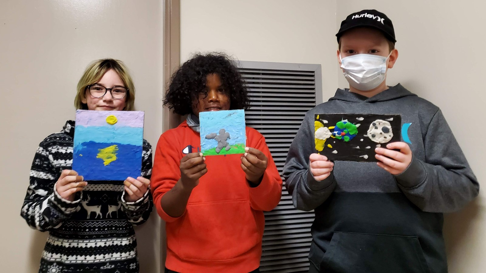 Some Cedar students showing their plasticine creations.